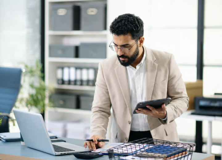 Adviser standing with a tablet, setting up a new company